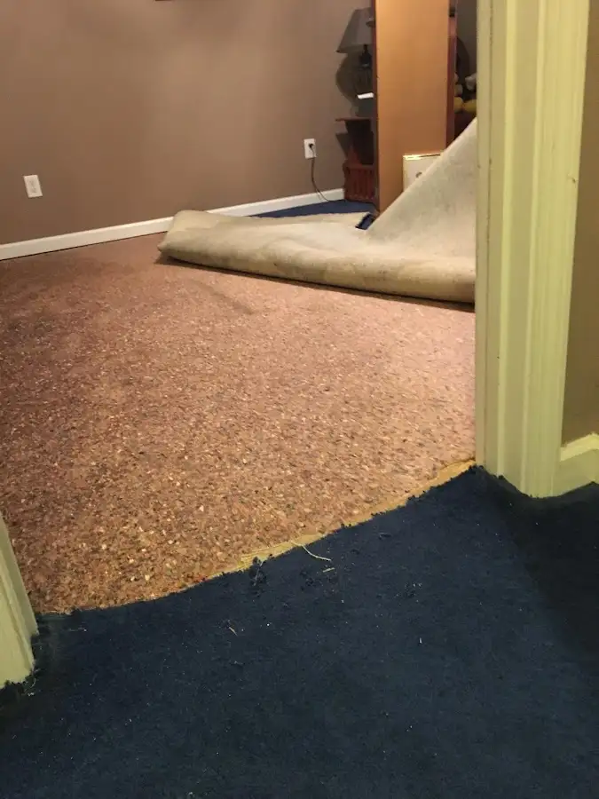 Carpet pad removal revealing water damage during Drying & Dehumidification in Chino